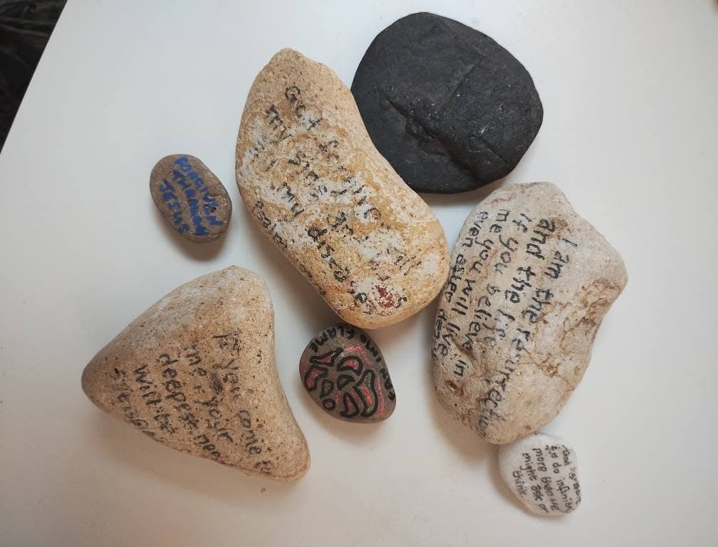 Painted prayer stones on a table